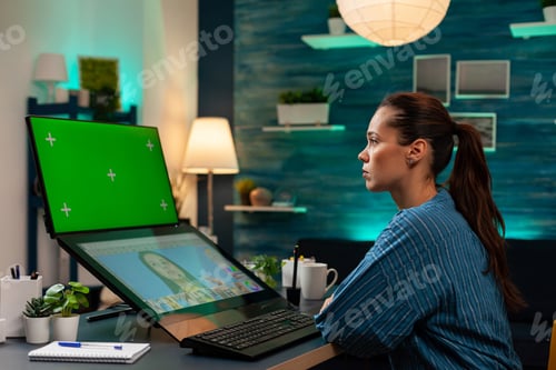 Preview: Studio editor worker looking at green screen on monitor