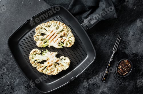 Preview: Vegetarian roasted cauliflower steak with herbs and spices in a grill skillet.