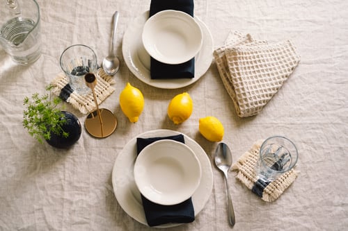 Preview: Vintage table setting with Linen napkins and yellow lemons.