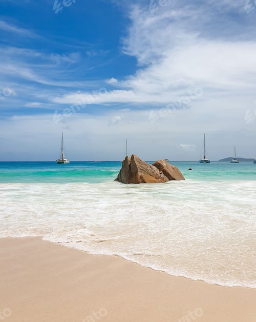 Preview: Exotic sandy beach summer with a view of sailboats on horizon.