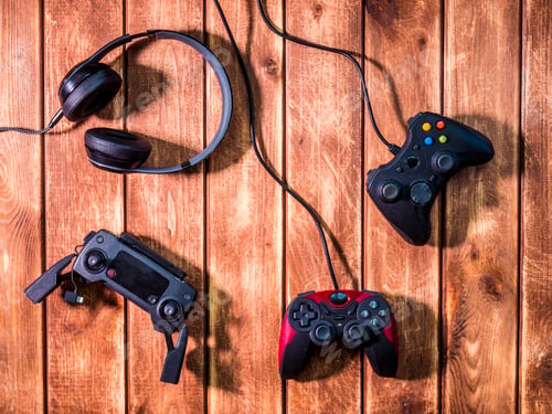 Preview: video gaming devices kit on the wooden table copy space