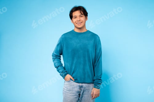 Preview: Guy Standing in Front of Blue Wall