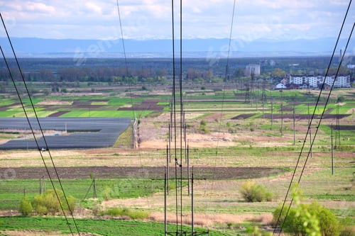 Preview: Steel pillar with high voltage electric power lines delivering electrical energy through cable wires
