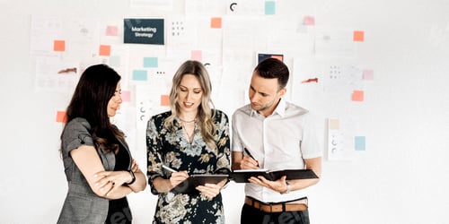 Preview: Business people writing down on a notebook