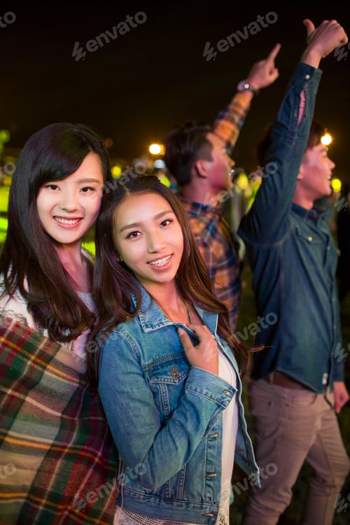 Preview: Smiling Women with Friends Enjoying a Night Out