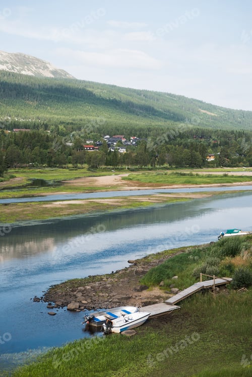 Preview: aerial view of lake with moored boats near pier in Trysil, Norway's largest ski resort