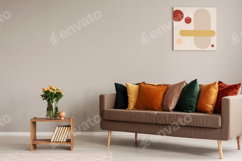 Preview: Roses in glass vase on wooden shelf with books next to comfortab