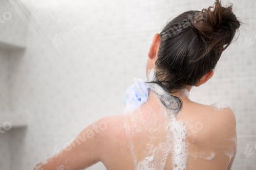 Preview: Happy beautiful woman is taking a shower