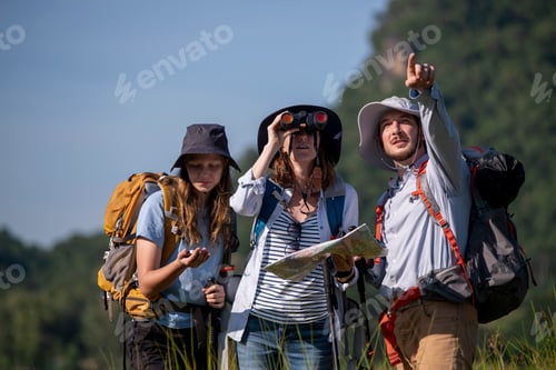 Preview: Family appears to be preparing for a hiking or camping expedition, as they are all equipped with bac