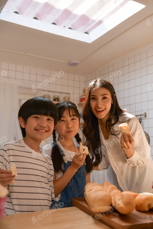 Preview: Family happy moments when children Helping mom cook food in the kitchen.