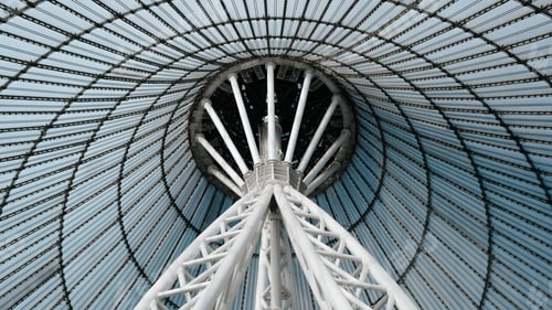 Preview: Futuristic tent-shaped roof, modern architecture close-up. Glass roof and steel pole, inside
