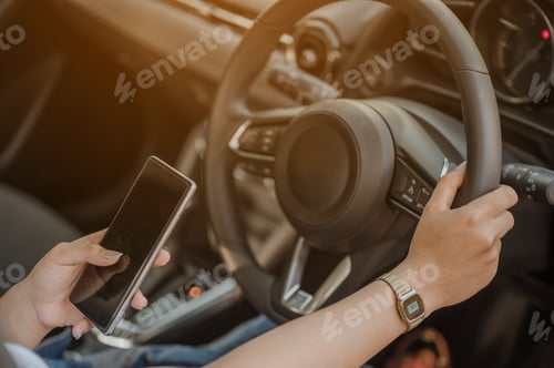 Preview: A woman was using her phone to find a map of the place she was traveling to before leaving.Holiday