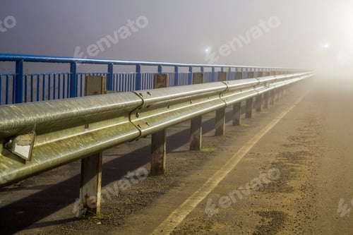 Preview: Thick fog over empty road at night