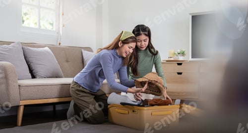 Preview: Asian beautiful two women friend prepare to pack clothes travel places with her friends travel bag
