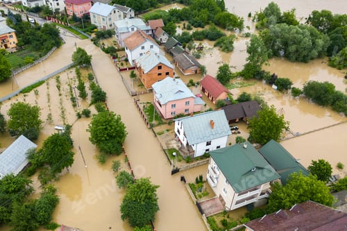 Preview: Aerial view of flooded houses with dirty water of Dnister river in Halych town, western Ukraine