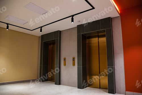 Preview: Golden Portals to the Upper Levels in a Modern Building Lobby