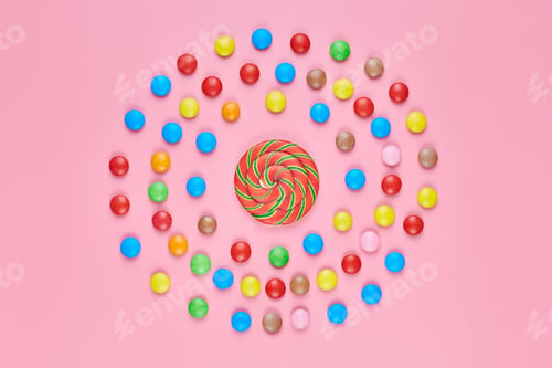 Preview: Sweet lollipop and candy on pink background
