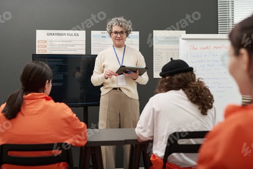 Preview: Middle Aged Man Teaching Prison Education Class to Female Inmates