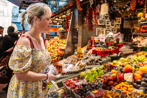 Preview: Woman choosing fruits at counter in market