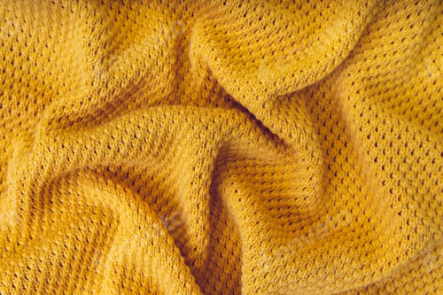 Preview: Yellow crumpled knitting wool texture background.