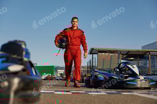 Preview: Go-kart driver walking to car before race at starting line