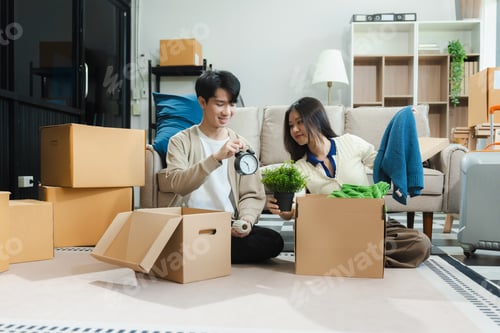 Preview: young couple helps put things in boxes and prepares to move to a new house.