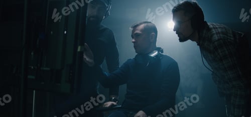 Preview: Medium Shot Of A Director Sitting Down Into His Chair And Starting Giving Instructions