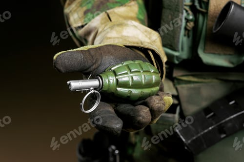 Preview: The Soldier In Full Combat Ammunition Holds A Grenade In His Hand. Mixed Media