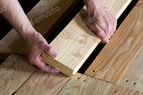 Preview: Close up of strong muscular hands of professional carpenter