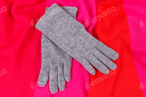 Preview: Pair of gray warm womanly gloves and colorful shawl for using in autumn or winter