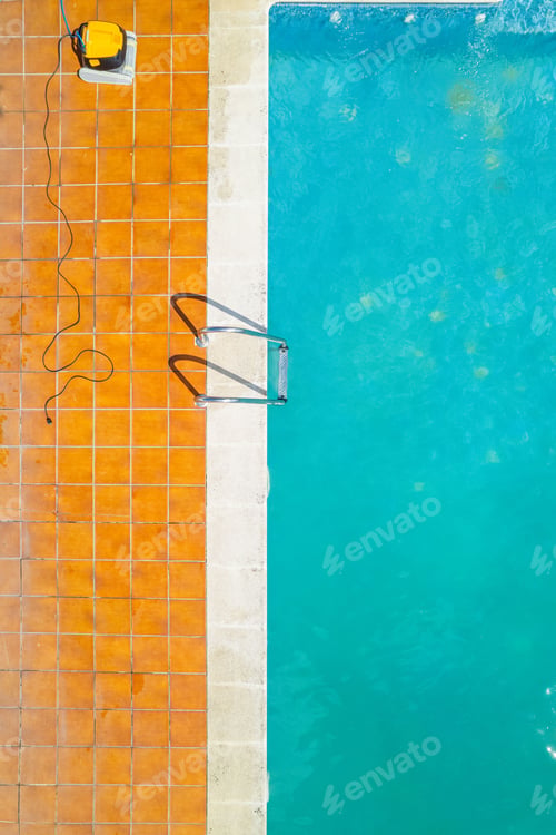 Preview: Top view of a part of a swimming pool in summer with a pool cleaning robot