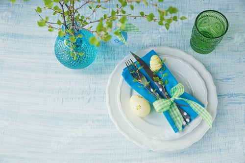 Preview: Easter table setting with painted eggs, green spring branch and cutlery