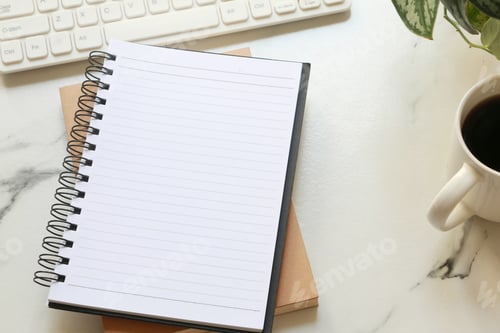 Preview: Blank note book on office desk