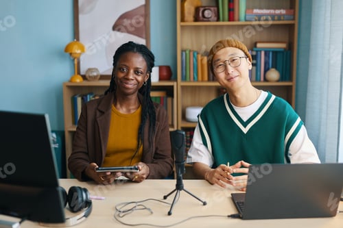 Preview: Smiling Colleagues Collaborating in Modern Office Space