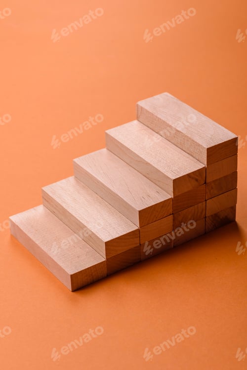 Preview: Conceptual composition of wooden steps with coins, model of a house
