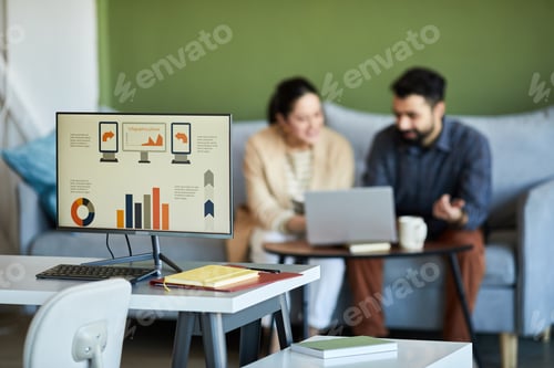 Preview: Workplace of economist or analyst with computer monitor and data on the screen