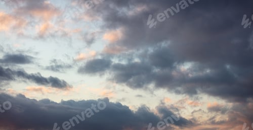 Preview: Dramatic magical sunrise cloudscape over blue gray color cloudy sky