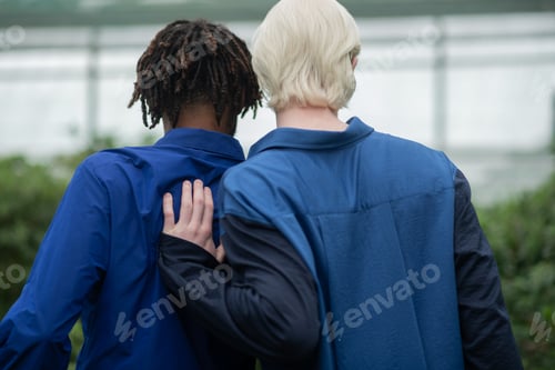 Preview: Men with different nationality wearing blue shirts