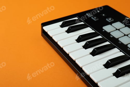 Preview: Midi keyboard on orange background, space for text