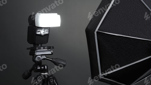 Preview: Flash light on tripod in studio production set up for photographer