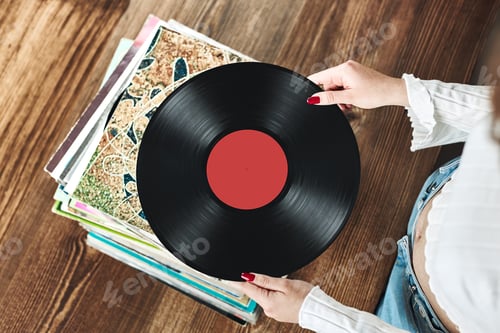 Preview: Playing vinyl records. Listening to music from vinyl record. Retro vintage style. Music passion