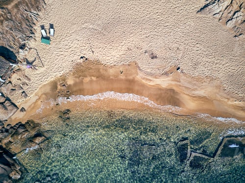 Preview: Man in hammock on a beach aerial view