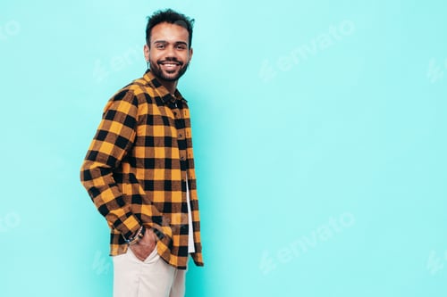 Preview: Portrait of young handsome man posing in studio