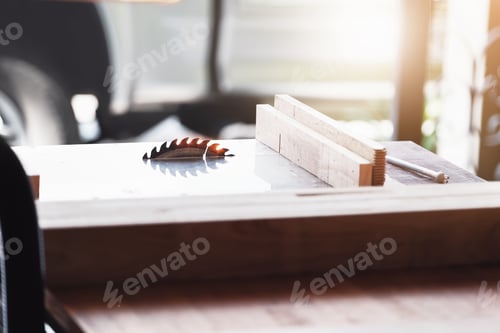 Preview: Focus on saw blade for cutting wood Logs that are about to be cut on the workbench. For working in