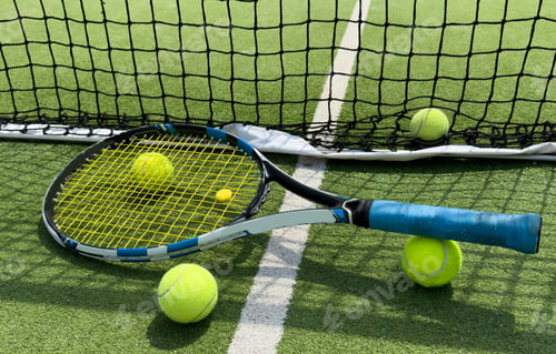 Preview: Tennis balls on a racket on the court ground