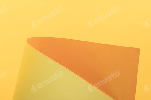 Preview: close-up view of bright yellow and orange paper background