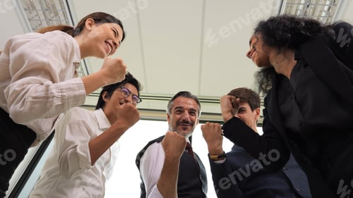 Preview: Happy business employees team celebrating success with praise in meeting room