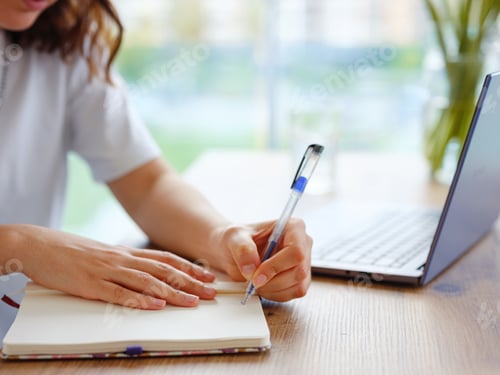 Preview: woman using laptop while working indoors