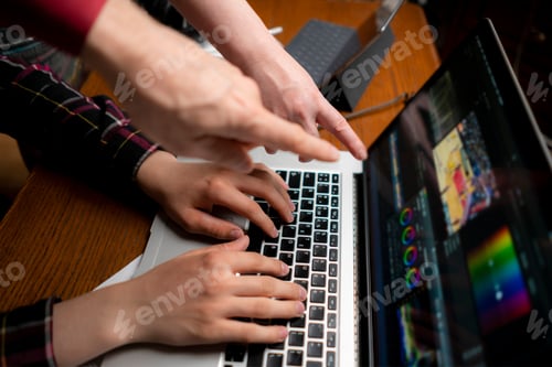 Preview: friendly team making movie using a laptop, videoediting process