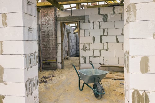 Preview: Interior of a private house with aerated concrete brick walls and wooden frame for future roof